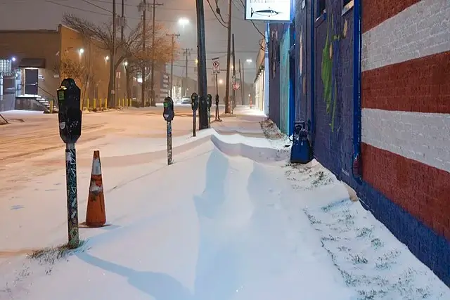 A snow covered sidewalk.